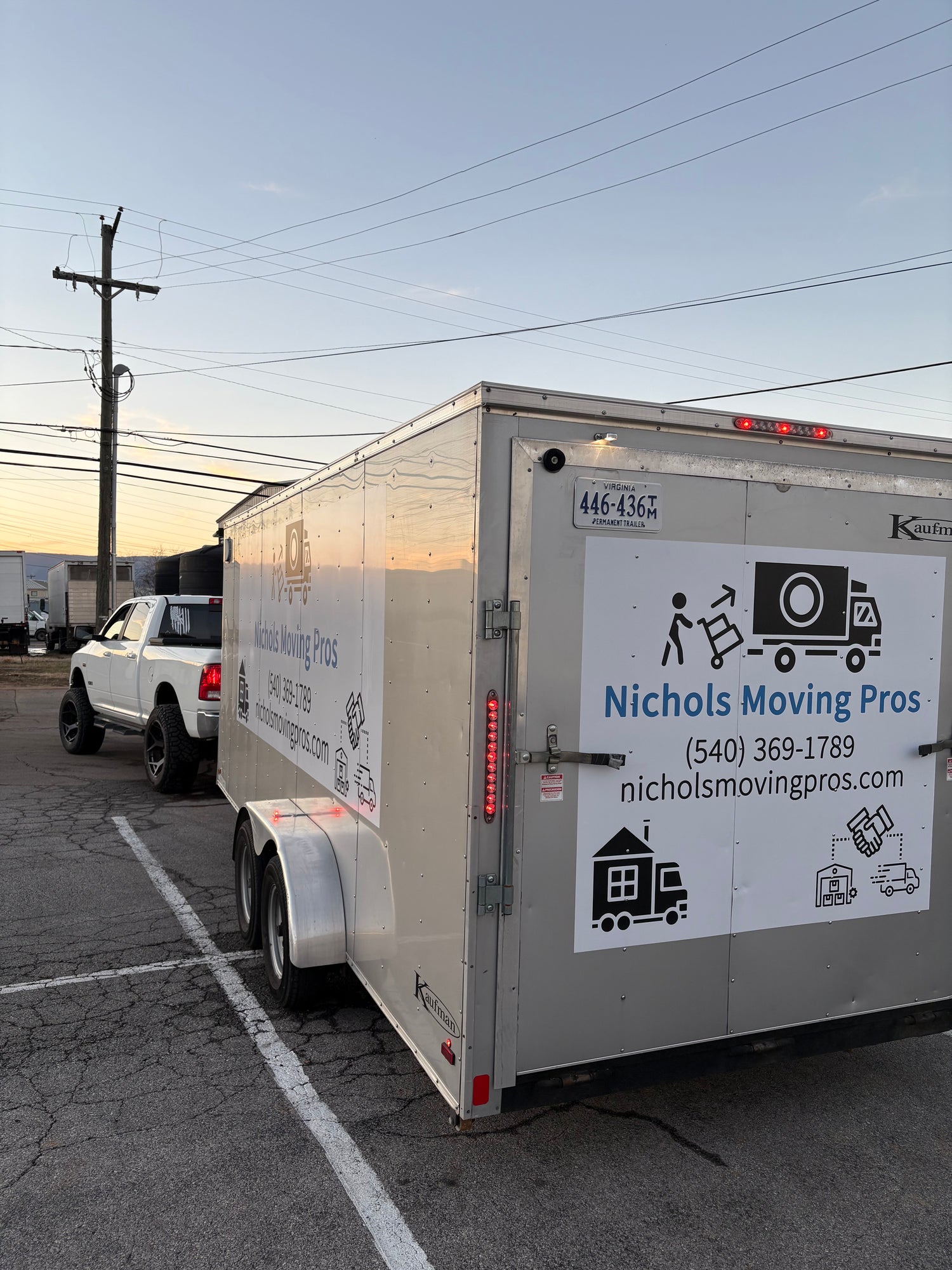 "A professional moving truck parked in front of a home, ready to load and transport belongings with Nichols Moving Pros."